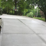 concrete driveway and basketball court
