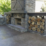 outdoor stone fireplace and patio