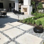 customer concrete patio with river rock kc